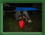 AmicalolaToUnicoi 001 * Justin and Mike trying to stay dry. Our first night on top of Springer Mountain * 2592 x 1944 * (1.24MB)